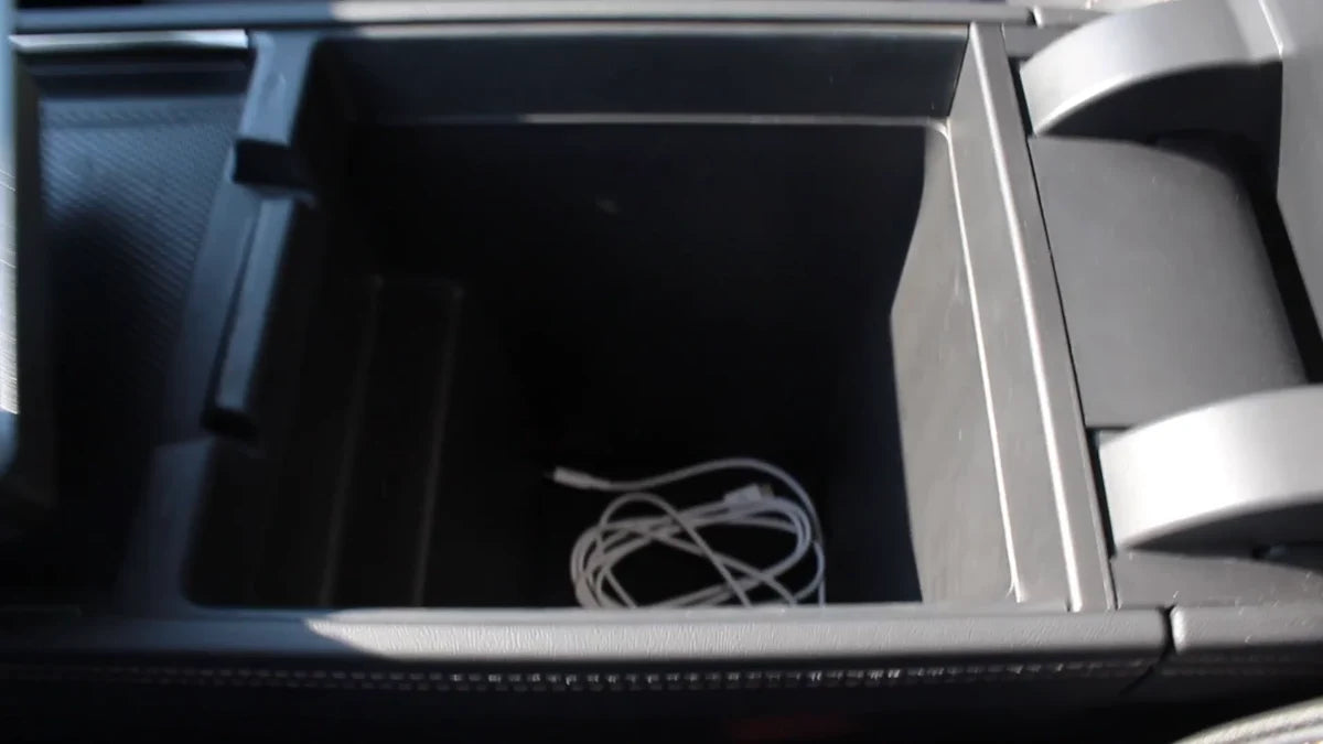 Rivian R2 center-console storage with the tray removed