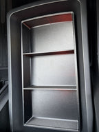 Empty Slide-Out Drawer Tray installed in a Rivian R2 console drawer showing its three open sections